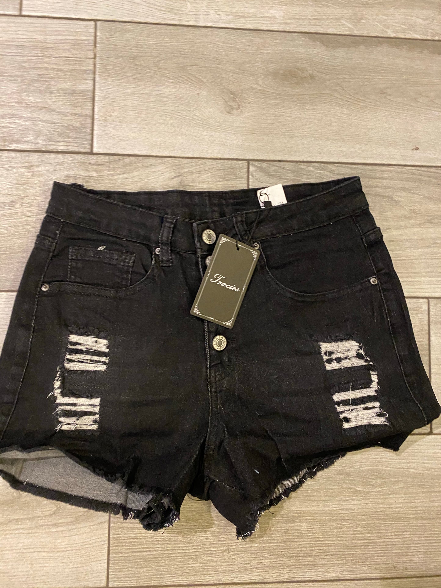 Denim black button up shorts.